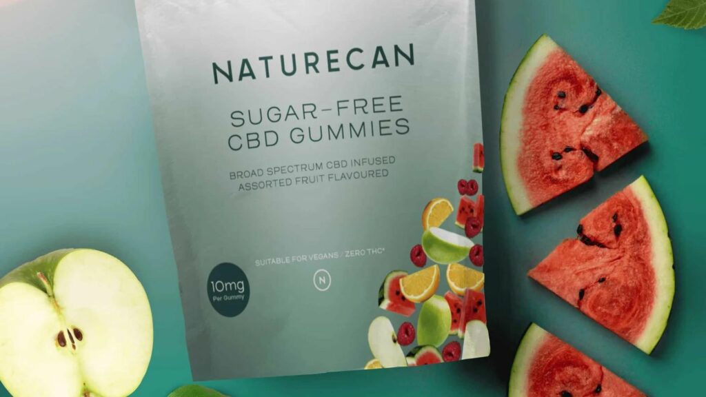 Organic Sugar-Free Gummies in a satchet, watermelon, apple on the side on the side of the satchet